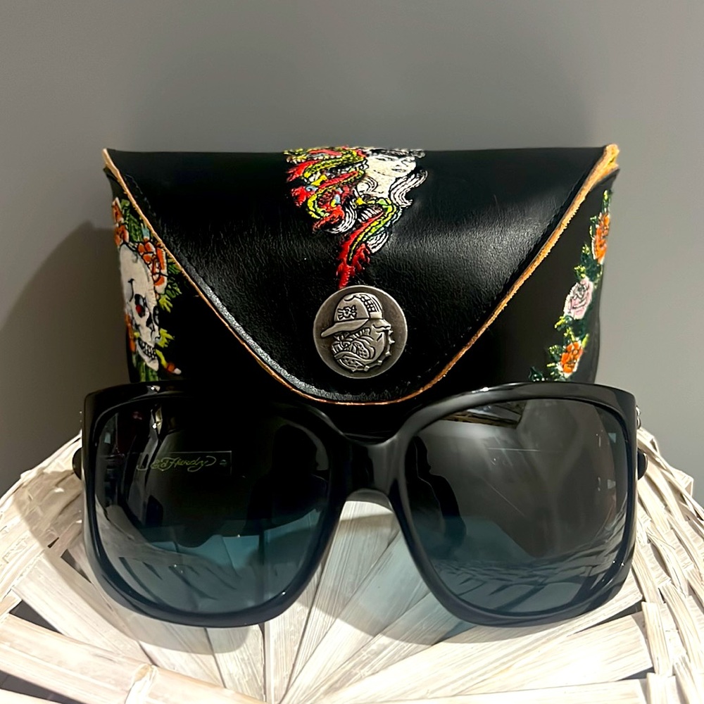 Ed Hardy sunglasses with leather carrying case.
